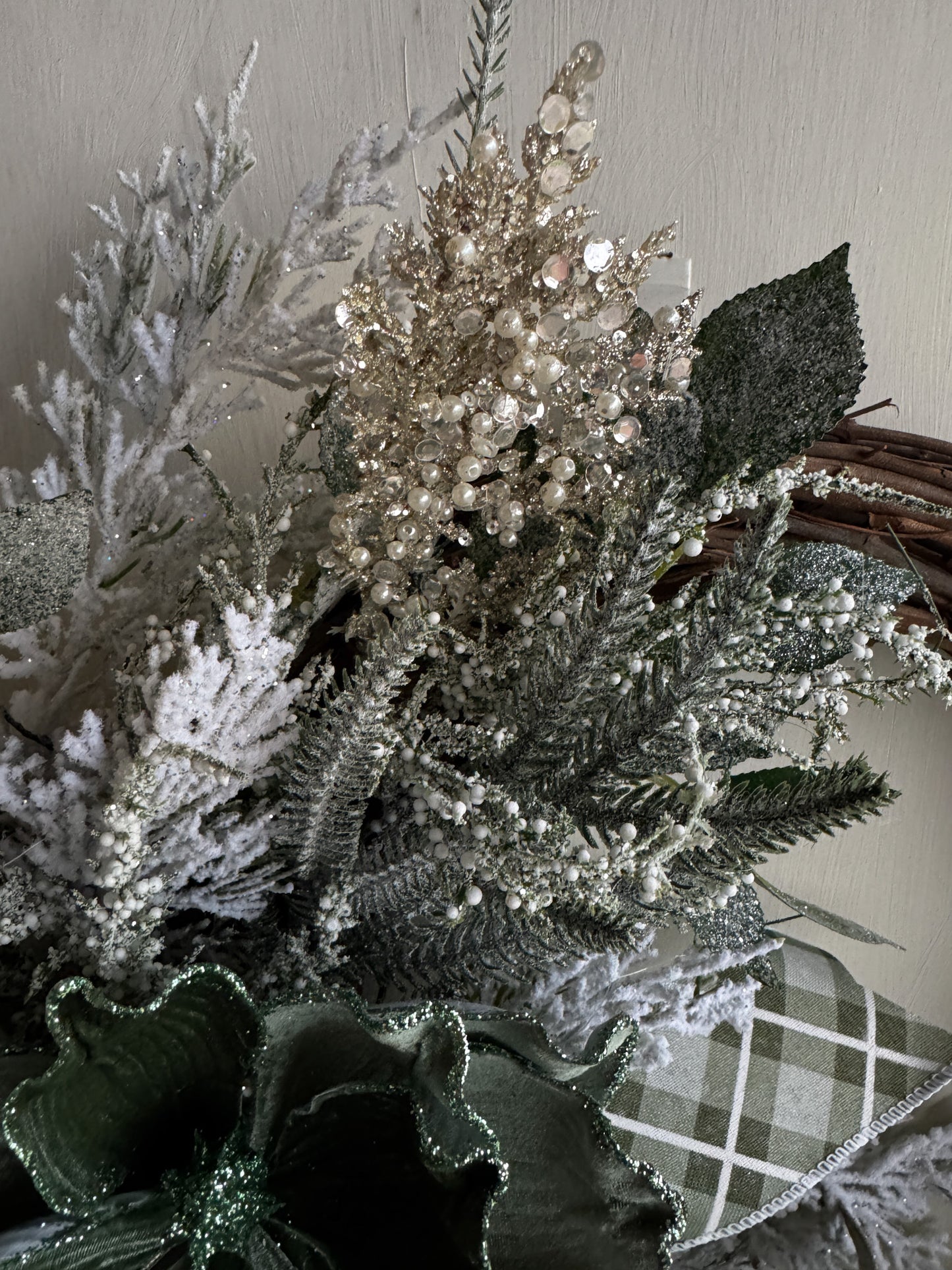 Winter Green Magnolia Grapevine Wreath with Jeweled Picks & Farrisilk Ribbon Short Description  Elegant, serene, and timeless — this handcrafted winter green magnolia wreath combines frosted greenery, jeweled accents, and luxurious Farrisilk ribbon.